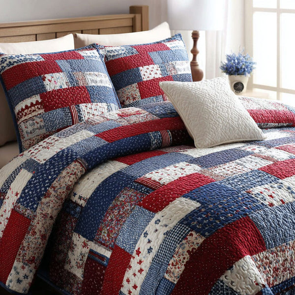 Red White Pride quilted 3-piece bedding set on a made bed with two matching pillow shams