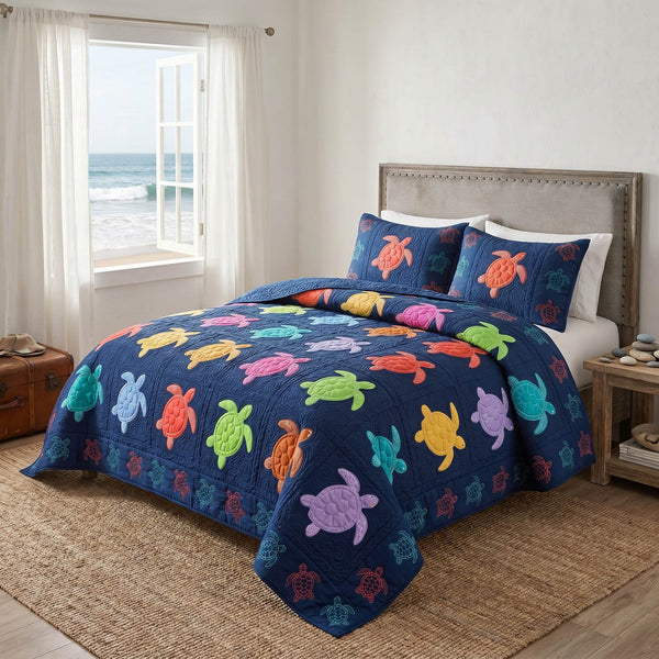 Reef Patch quilted 3-piece bedding set on a made bed in a light coastal bedroom