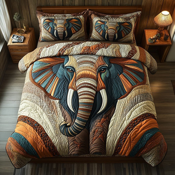 Regal Elephant quilted 3-piece bedding set on a made bed with two matching pillow shams