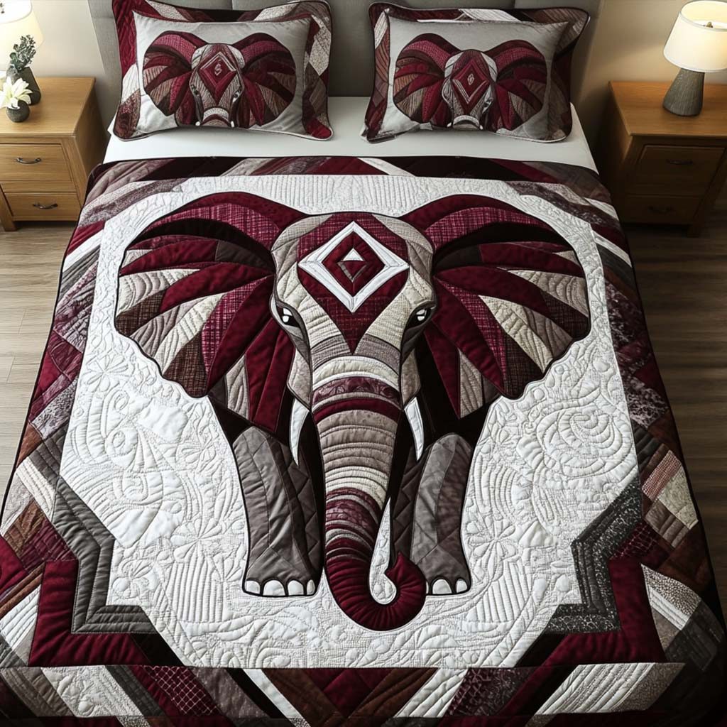 Regal Essence quilted 3-piece bedding set on a made bed with two matching pillow shams