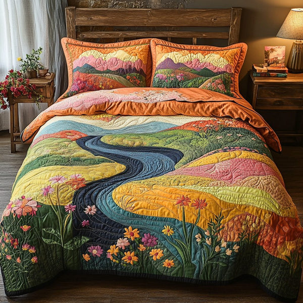 River Blossom quilted 3-piece bedding set on a made bed with two matching pillow shams
