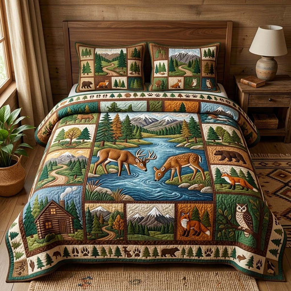 River Deer quilted 3-piece bedding set on a made bed with two matching pillow shams