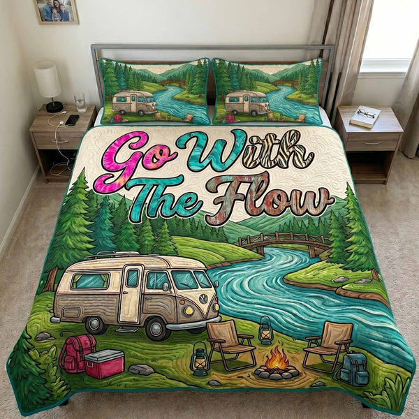 River Flow quilted 3-piece bedding set on a made bed with two matching pillow shams