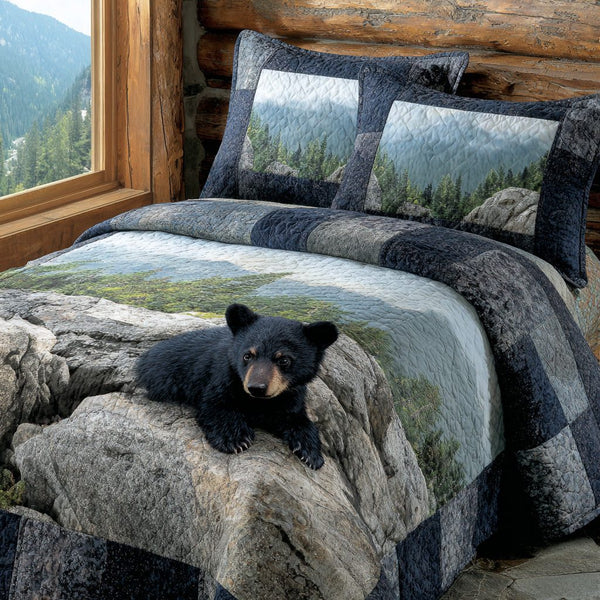 Riverstone Black Bear quilted 3-piece bedding set on a made bed with two matching pillow shams