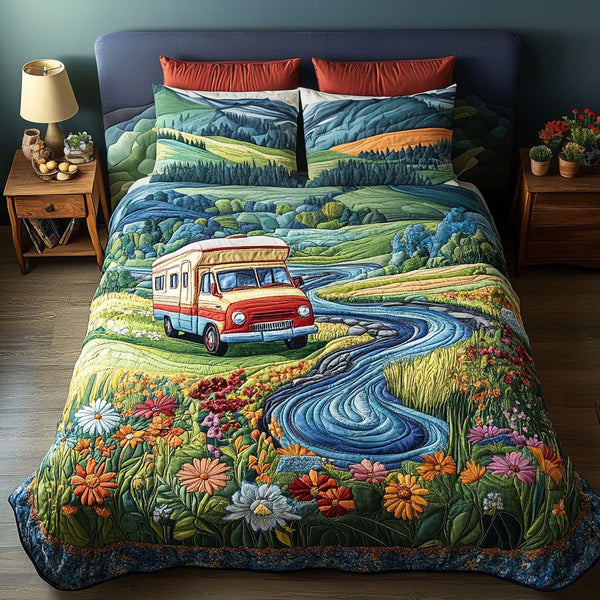 Rolling Away quilted 3-piece bedding set on a made bed with two matching pillow shams