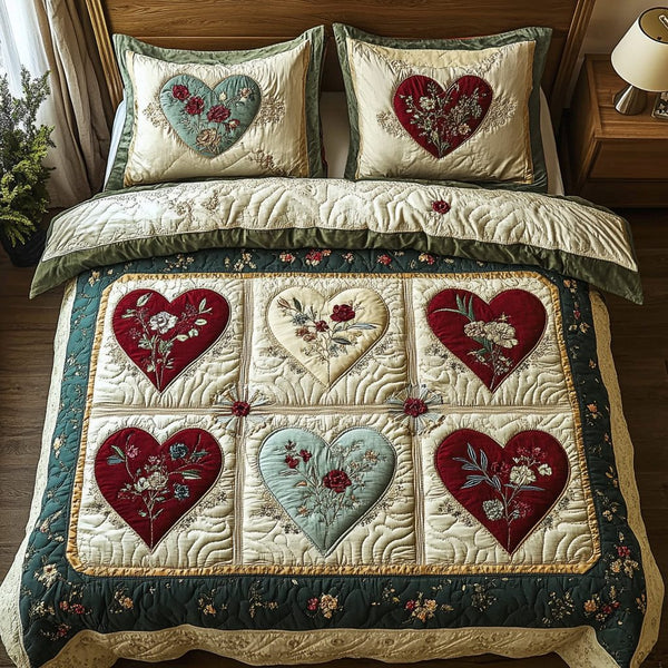 Romantic Bliss quilted 3-piece bedding set on a made bed with two matching pillow shams