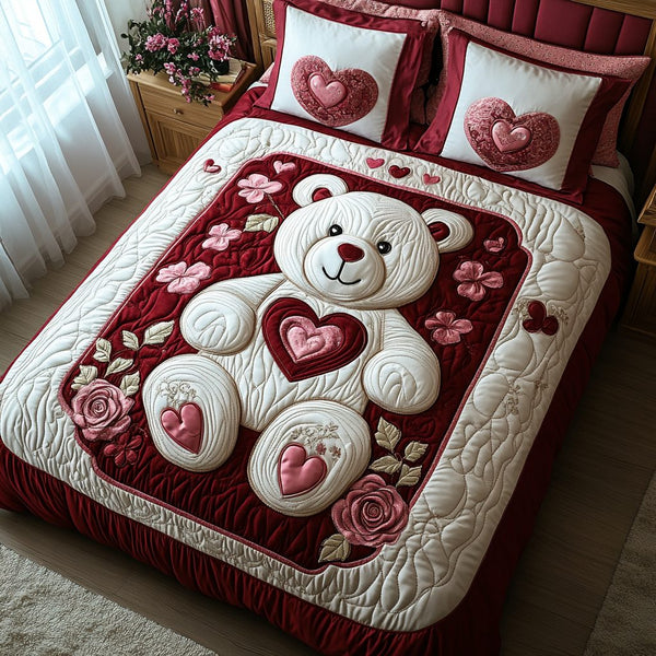 Romantic Charm quilted 3-piece bedding set on a made bed with two matching pillow shams