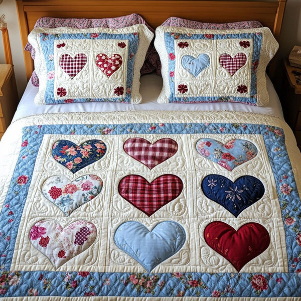 Romantic Flower Hearts quilted 3-piece bedding set on a made bed with two matching pillow shams