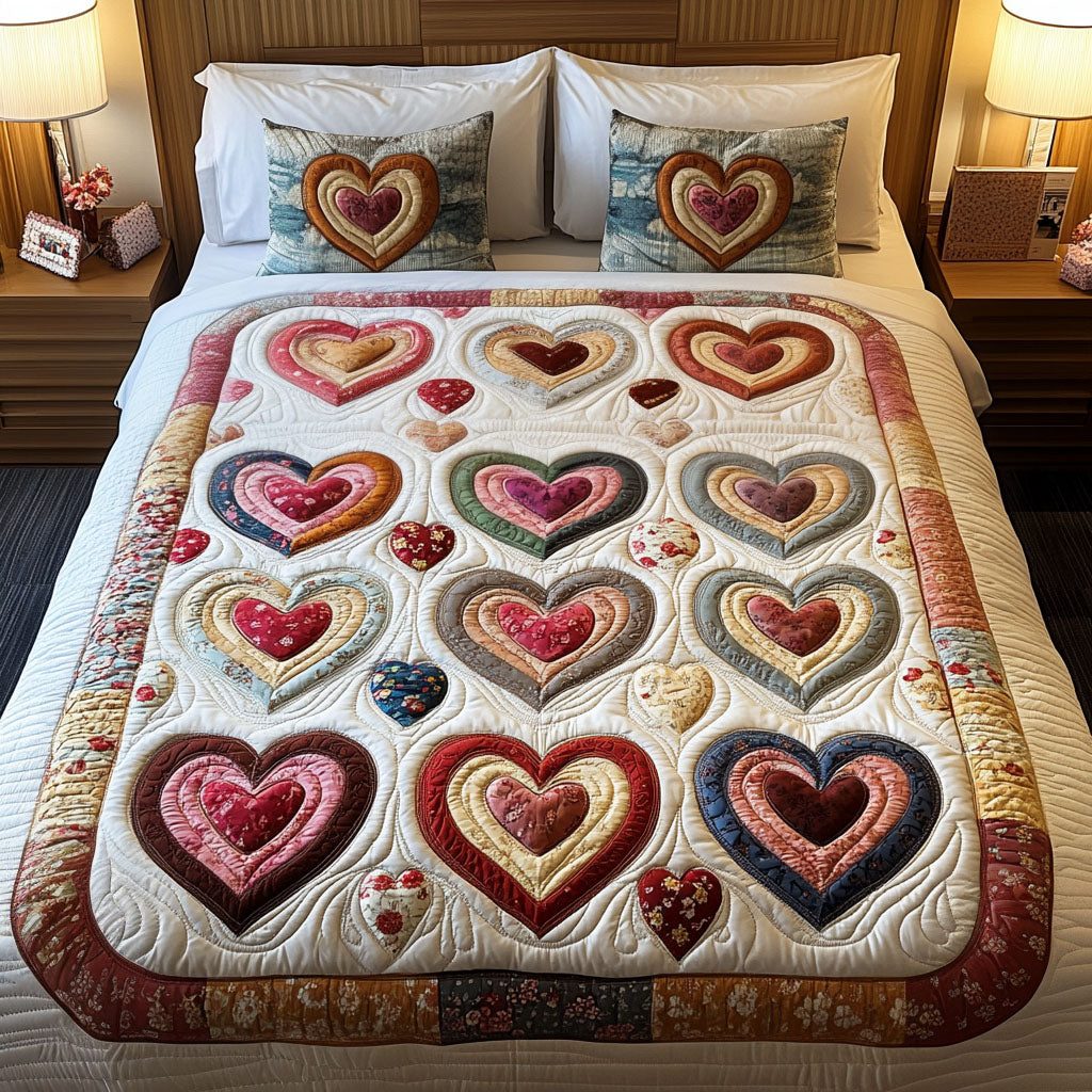 Romantic Petals quilted 3-piece bedding set on a made bed with two matching pillow shams