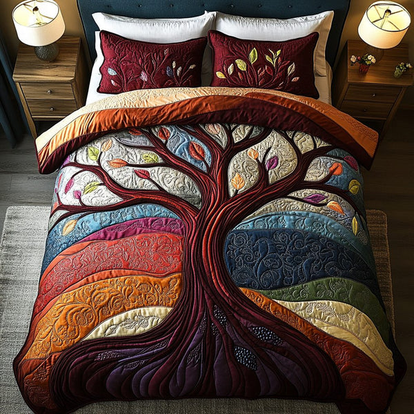 Rooted Life quilted 3-piece bedding set on a made bed with two matching pillow shams