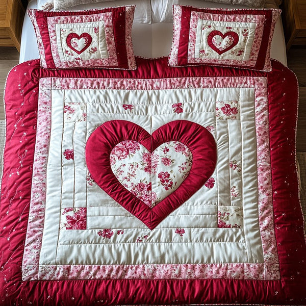 Rose Embrace quilted 3-piece bedding set on a made bed with two matching pillow shams