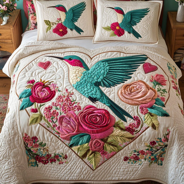 Rose Flutter quilted 3-piece bedding set on a made bed with two matching pillow shams