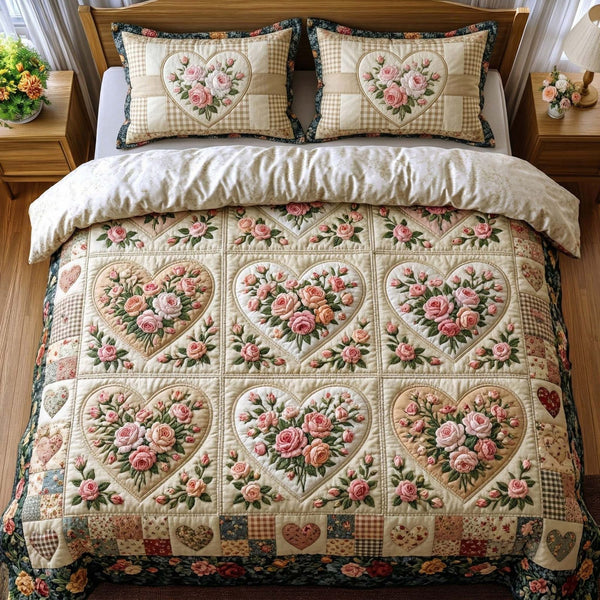 Rose Garden Hearts quilted 3-piece bedding set on a made bed with two matching pillow shams