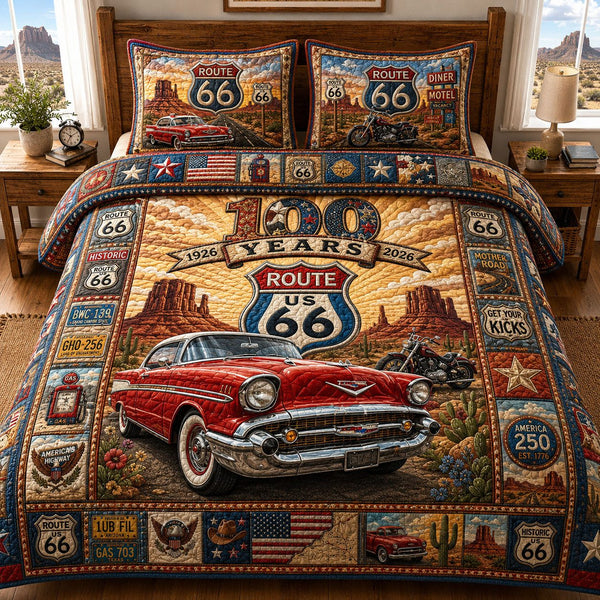 Route 66 100 Years quilted 3-piece bedding set on a made bed with two matching pillow shams