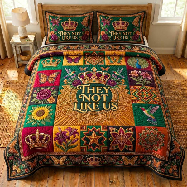 Royal Bloom quilted 3-piece bedding set on a made bed with two matching pillow shams