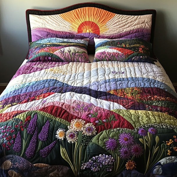 Royal Blossom quilted 3-piece bedding set on a made bed with two matching pillow shams
