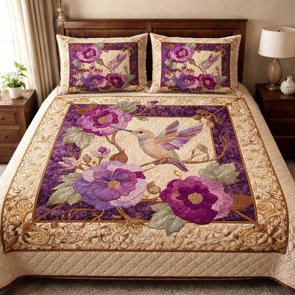 Royal Blossom quilted 3-piece bedding set on a made bed with two matching pillow shams