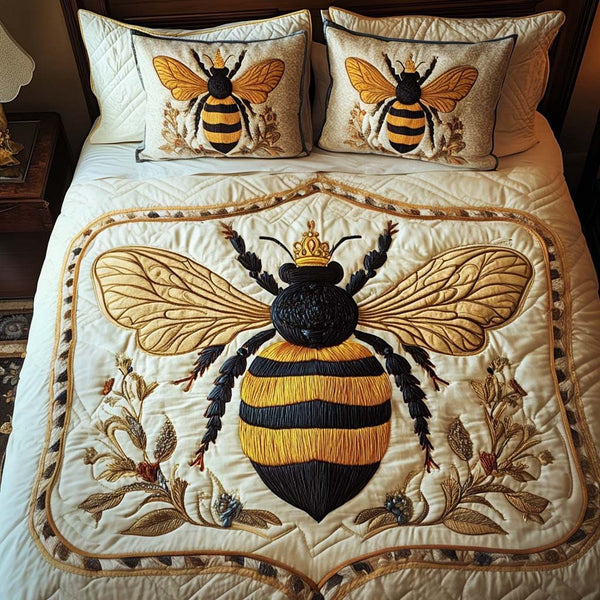 Royal Hive quilted 3-piece bedding set on a made bed with two matching pillow shams