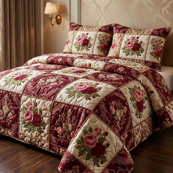 Royal Roses quilted 3-piece bedding set on a made bed with two matching pillow shams