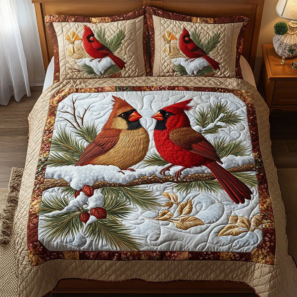 Ruby Companions quilted 3-piece bedding set on a made bed with two matching pillow shams