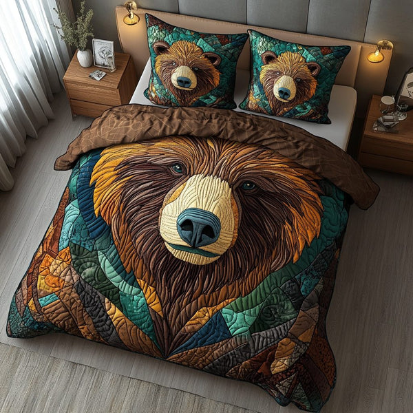 Sacred Bear quilted 3-piece bedding set on a made bed in a softly lit bedroom