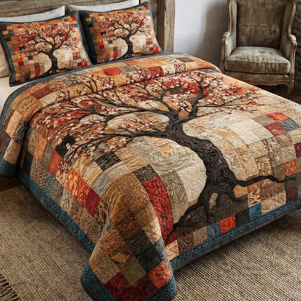 Sacred Branches quilted 3-piece bedding set on a made bed in a softly lit bedroom