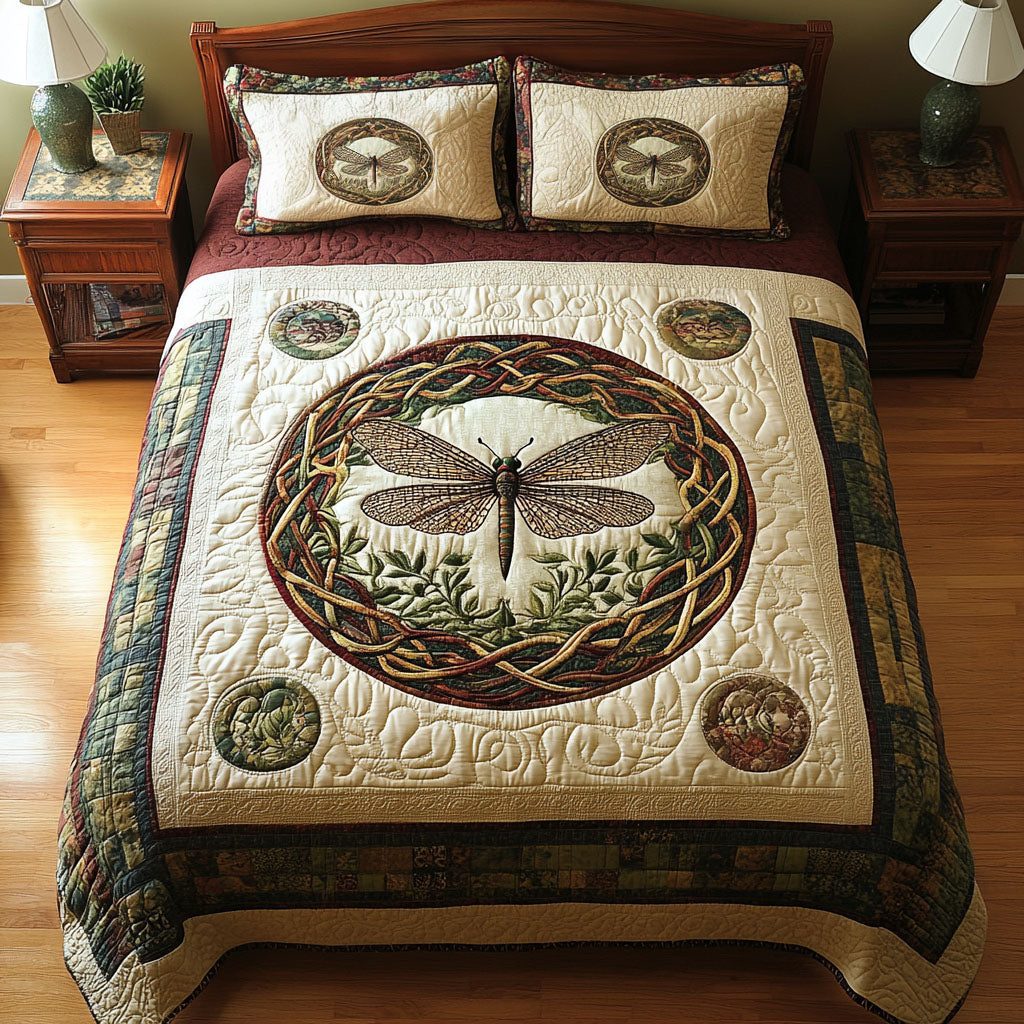 Sacred Dragonfly quilted 3-piece bedding set on a made bed in a softly lit bedroom