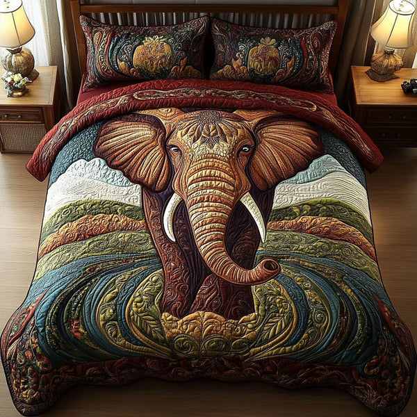 Sacred Elephant Escape quilted 3-piece bedding set on a made bed in a softly lit bedroom