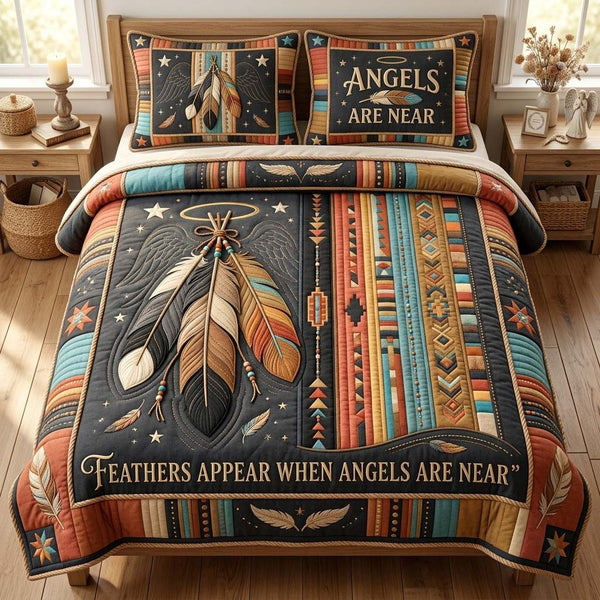 Sacred Feather Angels quilted 3-piece bedding set on a made bed in a softly lit bedroom