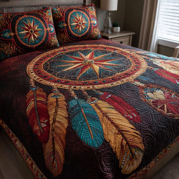 Sacred Feathers quilted 3-piece bedding set on a made bed in a softly lit bedroom
