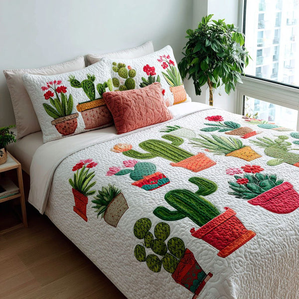 Sahara Cactus quilted 3-piece bedding set on a made bed with two matching pillow shams