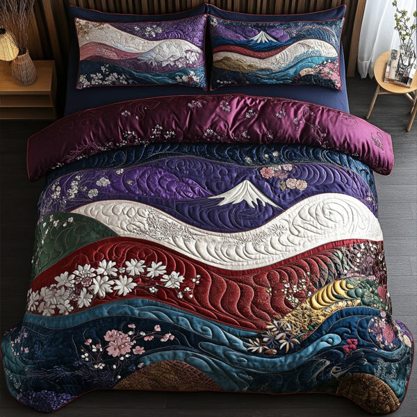 Sakura Breeze quilted 3-piece bedding set on a made bed with two matching pillow shams