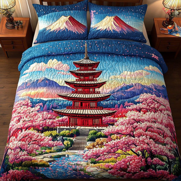 Sakura Dreamscape quilted 3-piece bedding set on a made bed with two matching pillow shams