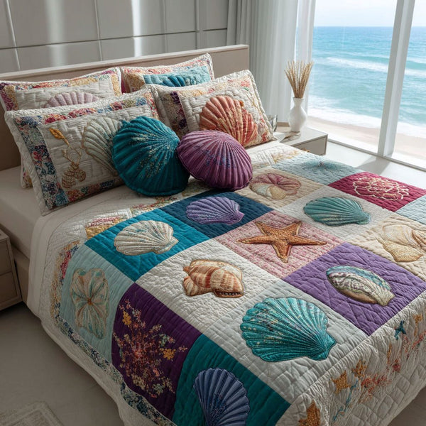 Sandy Waves quilted 3-piece bedding set on a made bed in a light coastal bedroom