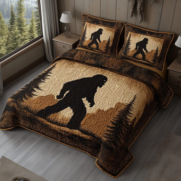 Sasquatch Trail quilted 3-piece bedding set on a made bed with two matching pillow shams