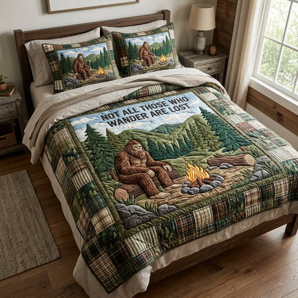 Sasquatch Woods quilted 3-piece bedding set on a made bed with two matching pillow shams