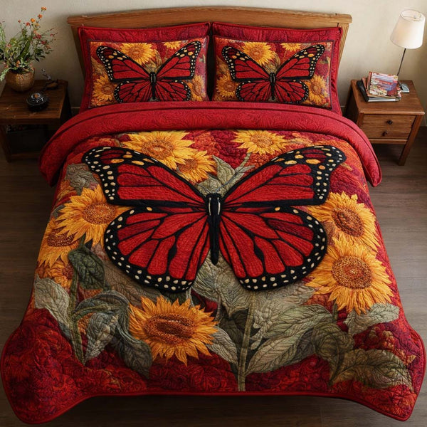 Scarlet Monarch quilted 3-piece bedding set on a made bed with two matching pillow shams