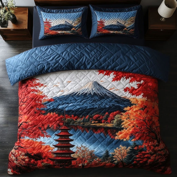 Scarlet Temple Sky quilted 3-piece bedding set on a made bed with two matching pillow shams