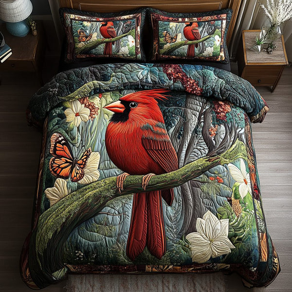 Scarlet Wings quilted 3-piece bedding set on a made bed with two matching pillow shams