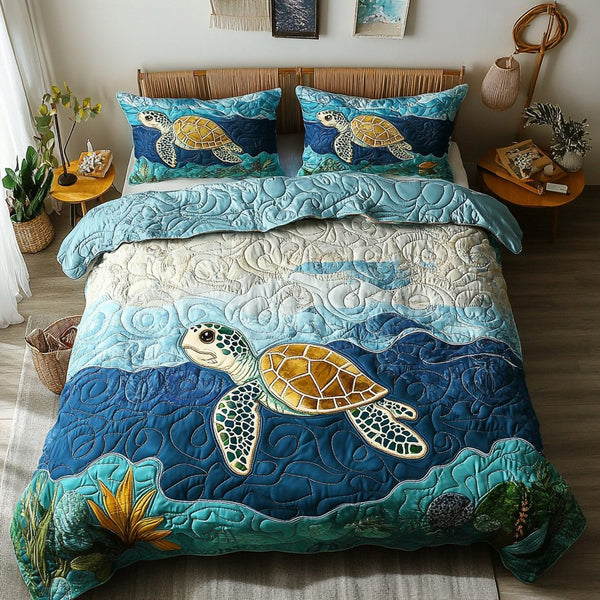 Sea Breeze Shells quilted 3-piece bedding set on a made bed in a light coastal bedroom