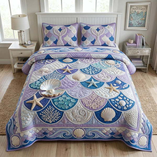 Sea Escape quilted 3-piece bedding set on a made bed in a light coastal bedroom