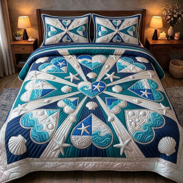 Sea Shells quilted 3-piece bedding set on a made bed in a light coastal bedroom