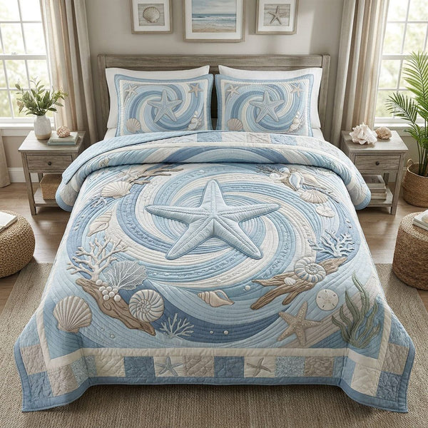 Sea Star Serenade quilted 3-piece bedding set on a made bed in a light coastal bedroom