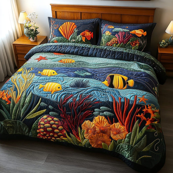 Sea Wonders quilted 3-piece bedding set on a made bed in a light coastal bedroom