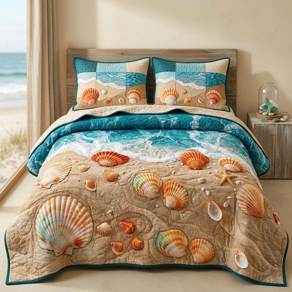 Seashell Beach quilted 3-piece bedding set on a made bed in a light coastal bedroom