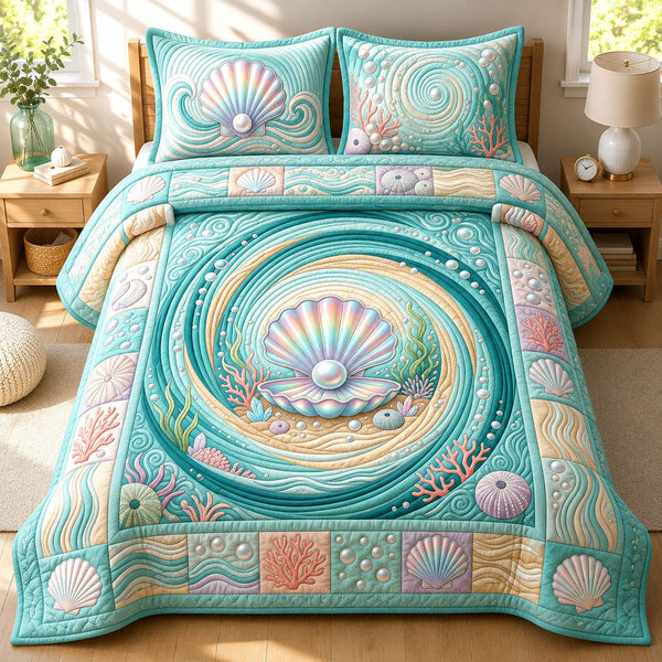 Seashell quilted 3-piece bedding set on a made bed in a light coastal bedroom