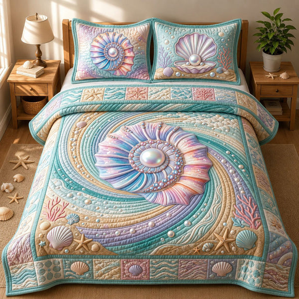 Seashell quilted 3-piece bedding set on a made bed in a light coastal bedroom