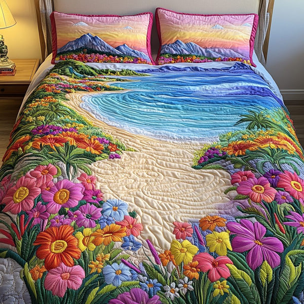 Seaside Flora quilted 3-piece bedding set on a made bed in a light coastal bedroom