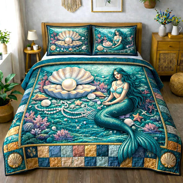 Seaside Shells quilted 3-piece bedding set on a made bed in a light coastal bedroom