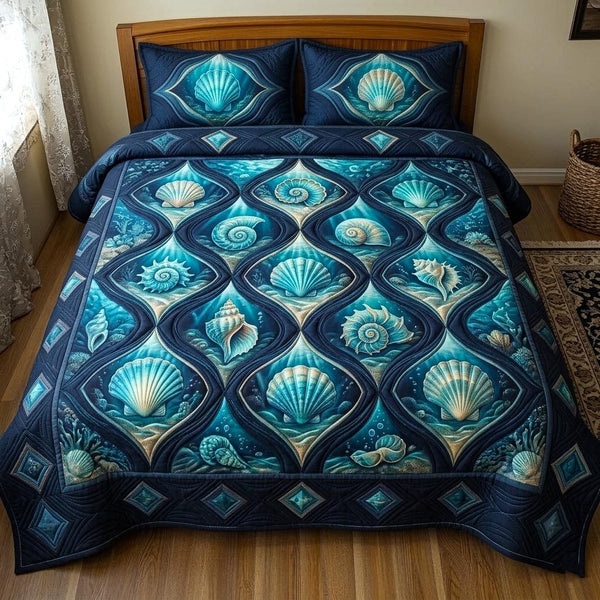 Seaside Shells quilted 3-piece bedding set on a made bed in a light coastal bedroom